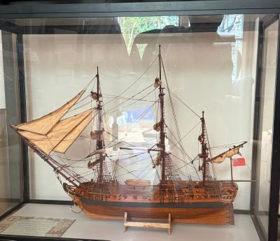 a model of a ship in a glass case
