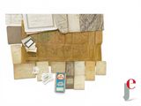 a pile of old papers and other items on a table