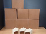 several cardboard boxes stacked on top of each other on a table