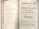 un livre ouvert sur la page du titre de Charles IX