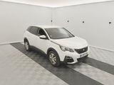 a white car parked in a garage with a checkered floor