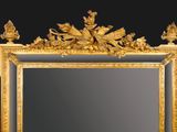 an image of a gold framed mirror on a black background