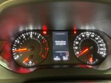 a close up of a car dashboard with various gauges