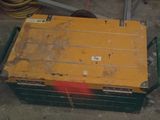 a box that is sitting on the ground next to a hose