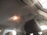 a view of the inside of a car with the sun shining through the window