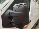an image of a van door mirror with a bag on it