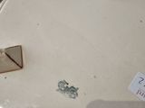 a white table with a clock on top of it