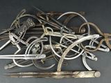 a pile of old tools that are on a table
