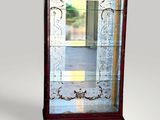 a glass display case with a mirror in it