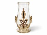 a glass vase with a gold fleuron design on it