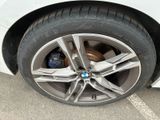 a close up of a tire on a white car