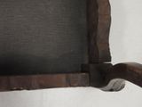 a picture of a wooden chair with a black seat