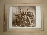 photograph of a group of soldiers posing for a picture in an old time photo