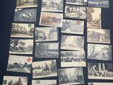 some old black and white photos of people and buildings on a table