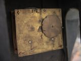 a clock that is hanging on the wall in the room