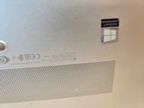 a close up of a silver laptop with a window on it