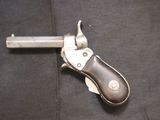 a small knife that is laying on a black cloth