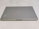 a laptop that is sitting on a white surface