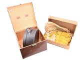 a box with a belt inside of it on a white surface
