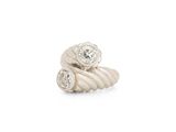a close up of a ring with two diamonds on it