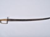 a close up of a knife on a white surface