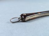 a keychain that has a small tortoise shell on it