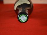 a bottle of wine that is sitting on a table