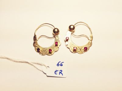 two pairs of gold earrings with garnets on a white background