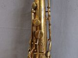 a gold saxophone that is sitting on a table
