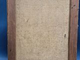 an old wooden easel with a painting on it on a blue background