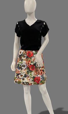 a mannequin wearing a skirt with flowers on it