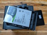 a hard drive sitting on top of a hard drive case