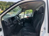 the interior of a white van with black seats and a steering wheel