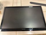 a flat screen tv sitting on a wooden table
