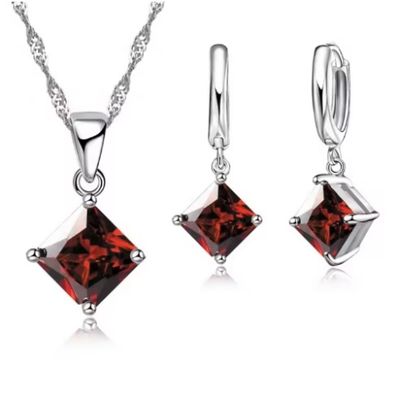 Parure, pendentif et paire de boucle d'oreille zircon teinte…