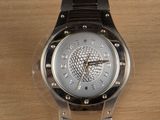 a watch that is sitting on a wooden table