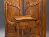 pair of antique french walnut doors and a side table
