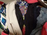 a pile of clothes and a pair of scissors on a table