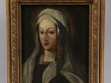 an oil painting of a woman with a veil on a wooden easel