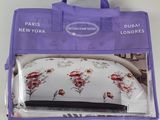 the purple bag is filled with a bedding set and a pillow