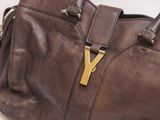 a brown purse with a gold y on it