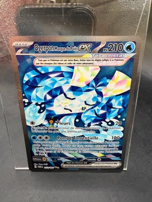 a close up of a box of pokemon cards on a table