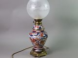 a lamp that is sitting on a table with a light on it