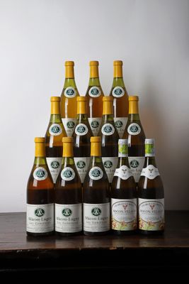 many bottles of wine sitting on a wooden table