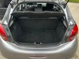 the back of a car with its trunk open in a parking lot