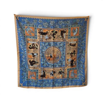 an image of a blue and orange scarf with animals on it