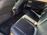 the back seats of a car are empty in the back of the car