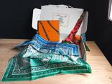 a box that has a scarf, scissors, and other items in it