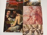 four books on a table, one of which is a painting and one of which is a painting