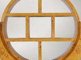 a wooden clock with a circular design on it